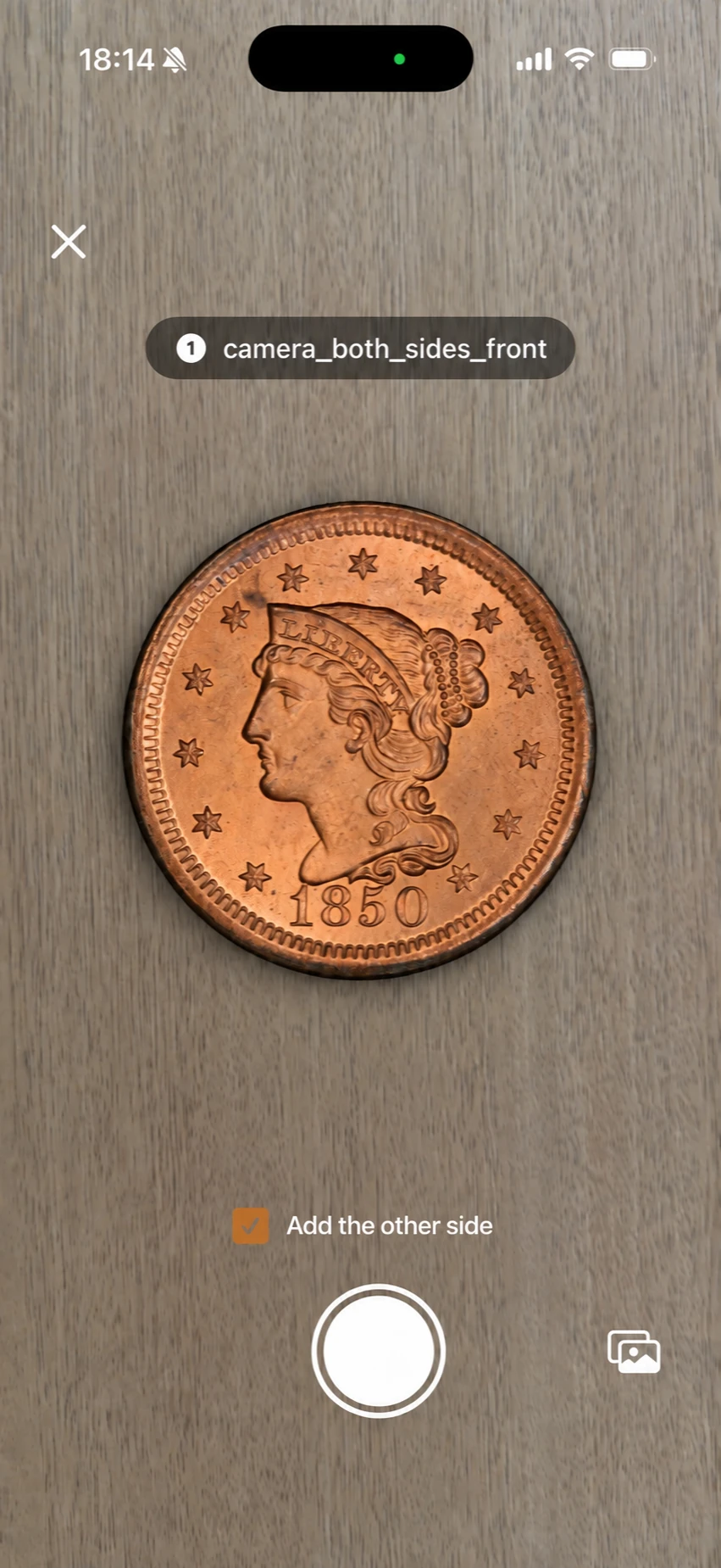 Coinara camera screen with an 1850 U.S. one-cent coin centered in the camera view