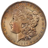 PCGS example of an 1884-S Morgan dollar with cleaning and artificial toning